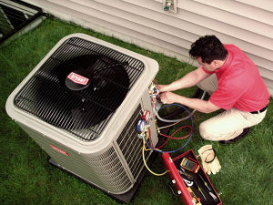 HVAC contractor servicing a system