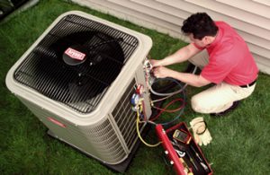 Technician installing a heat pump