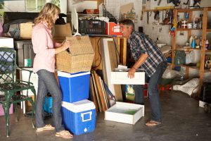 Man and woman organizing their garage