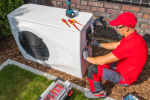 Professional HVAC Technician Repairing Modern Heat Pump Unit