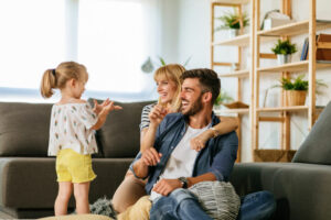 happy family enjoys cool comfort of air conditioned home
