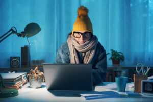 Woman feeling cold at home in winter