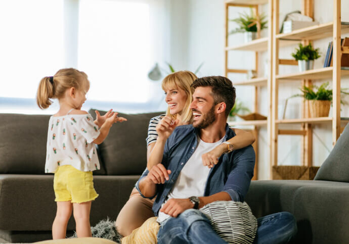 happy family enjoys cool comfort of air conditioned home