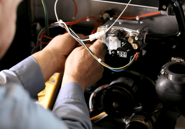 technician repairing hvac system