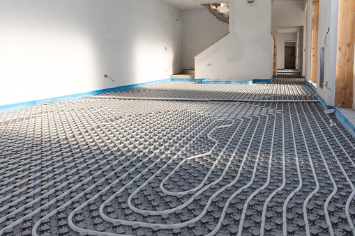 radiant heating pipes in commercial space before floor is in place